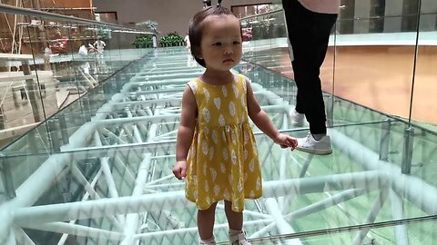 Watch this Cute Baby Girl Conquer her Fear of Walking on a Glass Bridge