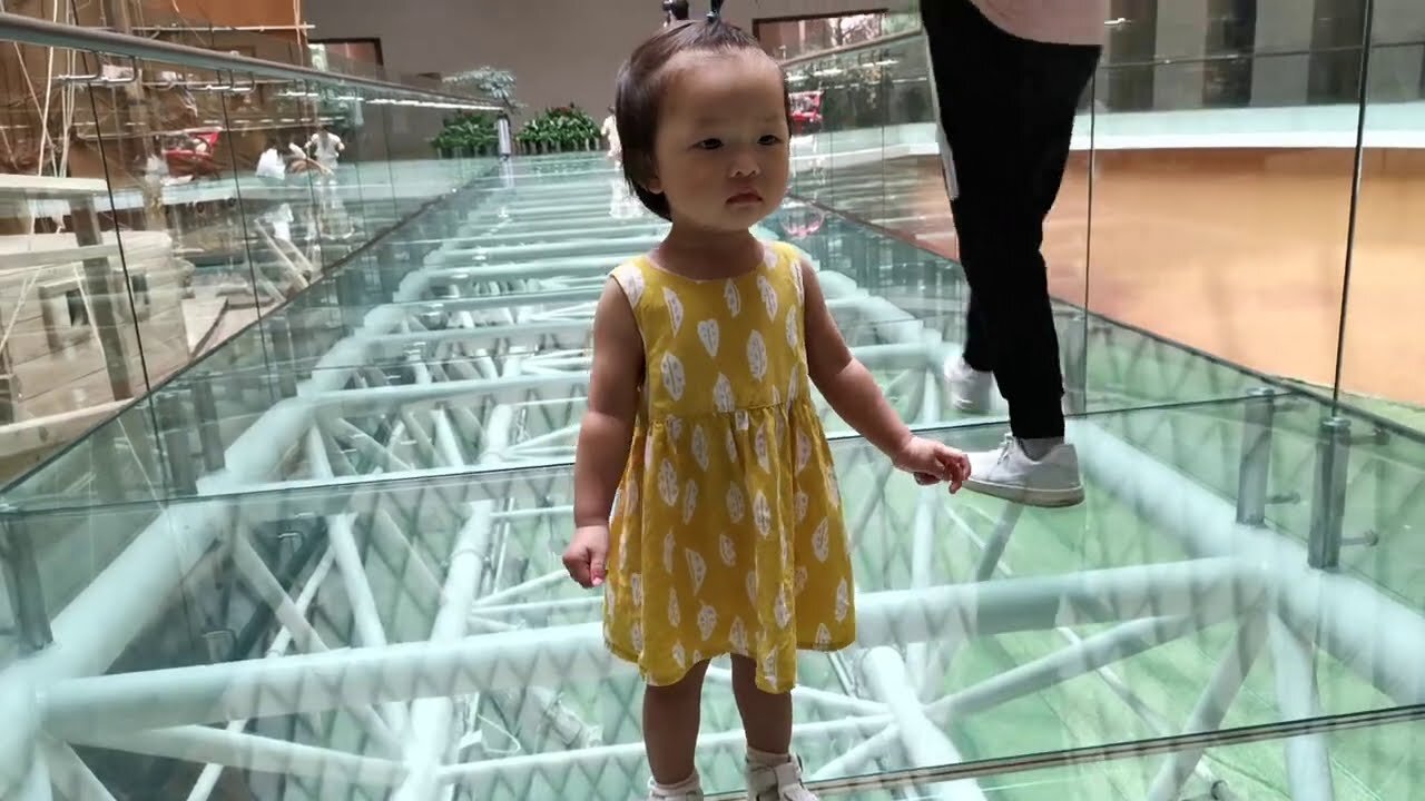 Watch this Cute Baby Girl Conquer her Fear of Walking on a Glass Bridge