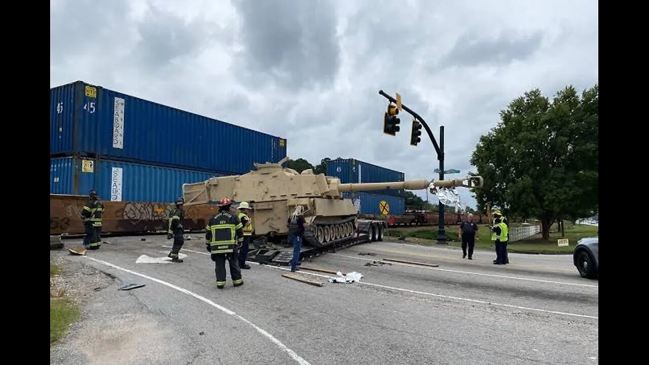 Train collides with truck carrying military vehicle in US, South Carolina