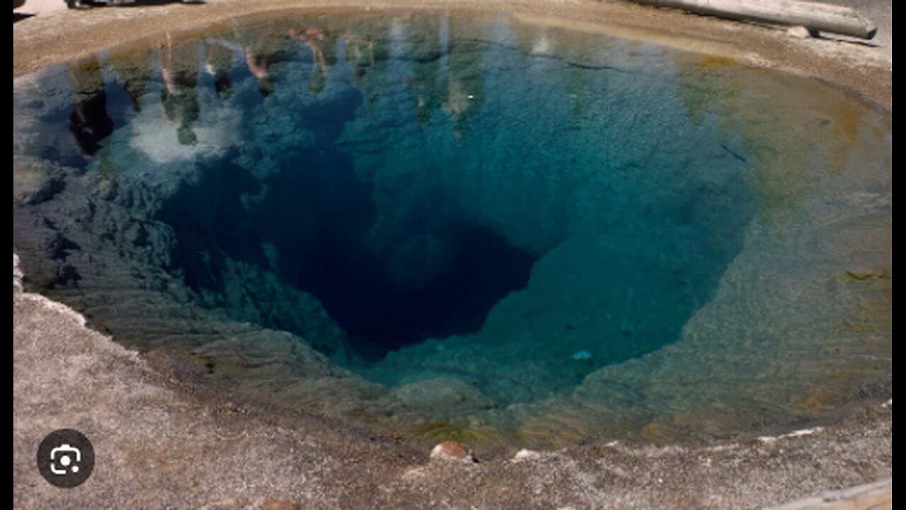 YELLOWSTONE MORNING GLORY POOL BLUE COLOR RUINED BY IT BEING USED AS A WISHING WELL