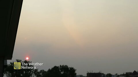 Sunset shrouded by smoky skies