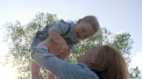 Mother plays with her beautiful son, beautiful scene