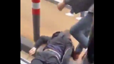 Invaders in France messing with a girl, gets thrown off of bus 