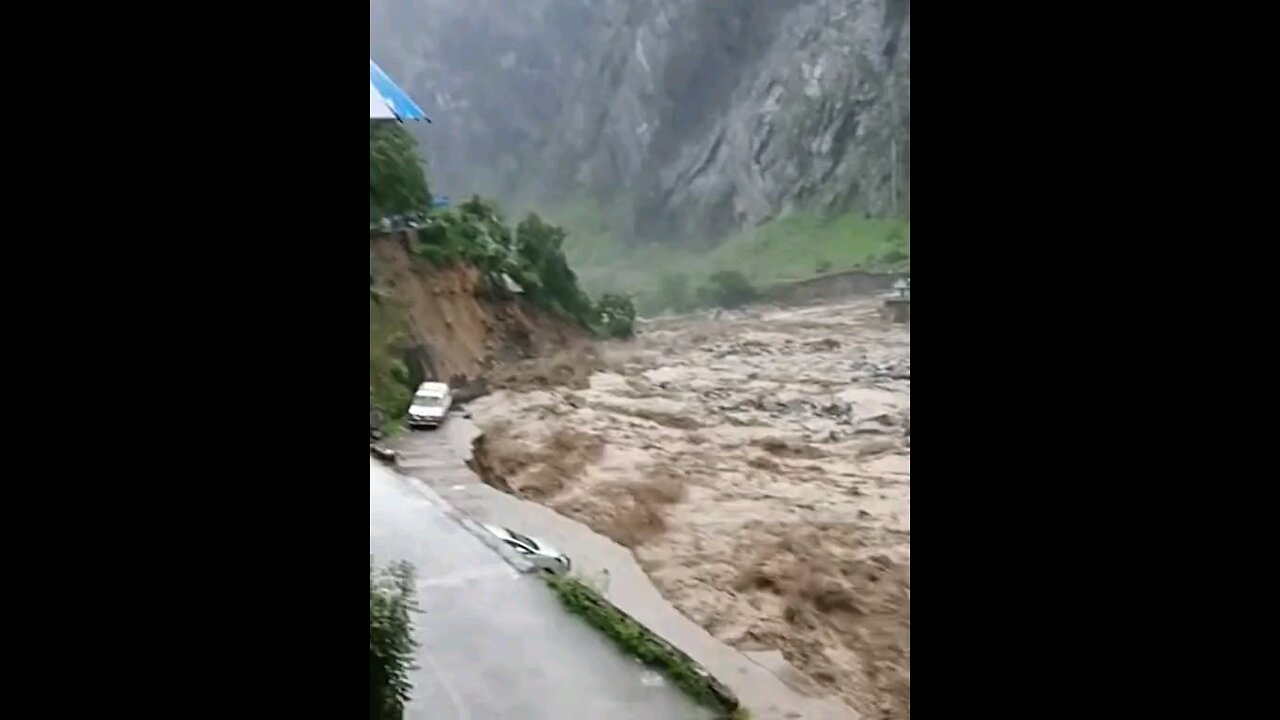 River's Rampage Devouring Roads and Vehicles