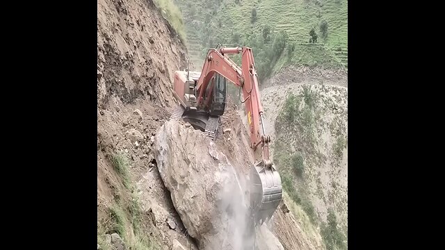 Dangerous work of Hitachi excavator on cliffs