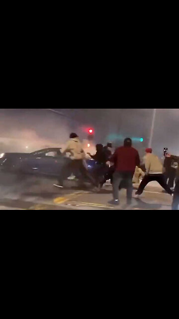 Car Runs Over a Bunch of Idiots Doing Intersection Burnouts & Donuts