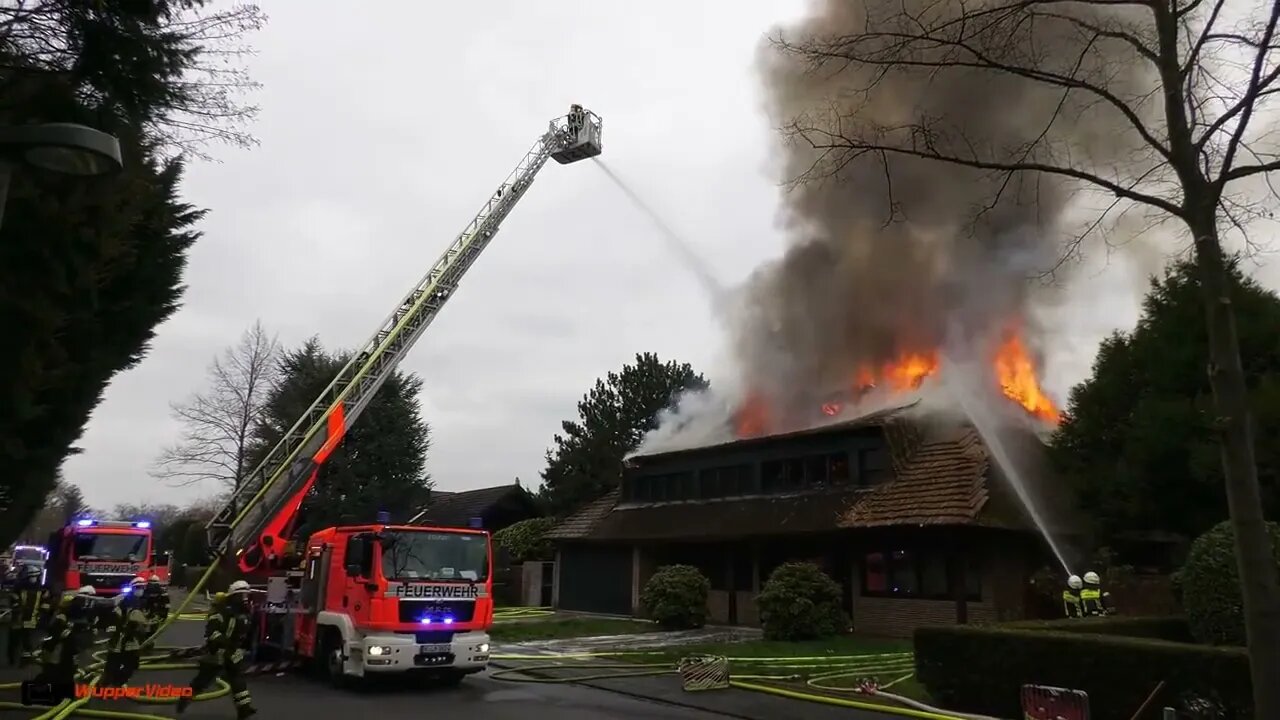 4. Smoke billows from thatched cottage fire
