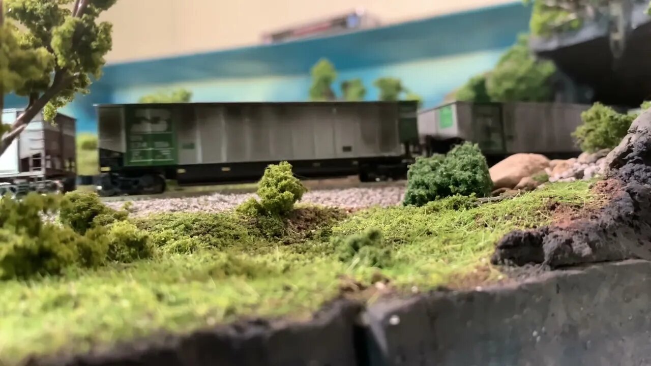 N scale coal train starting the climb up the pass