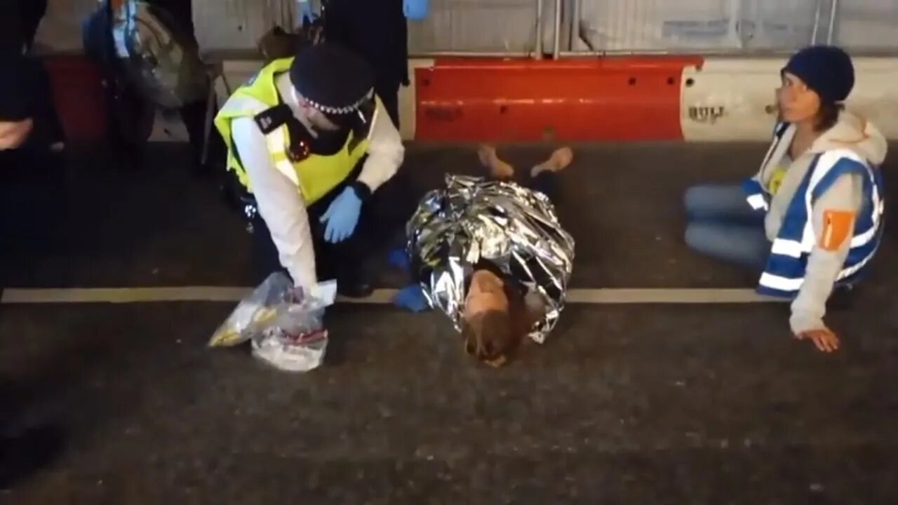 After arresting the protester's police give him a foil blanket #metpolice