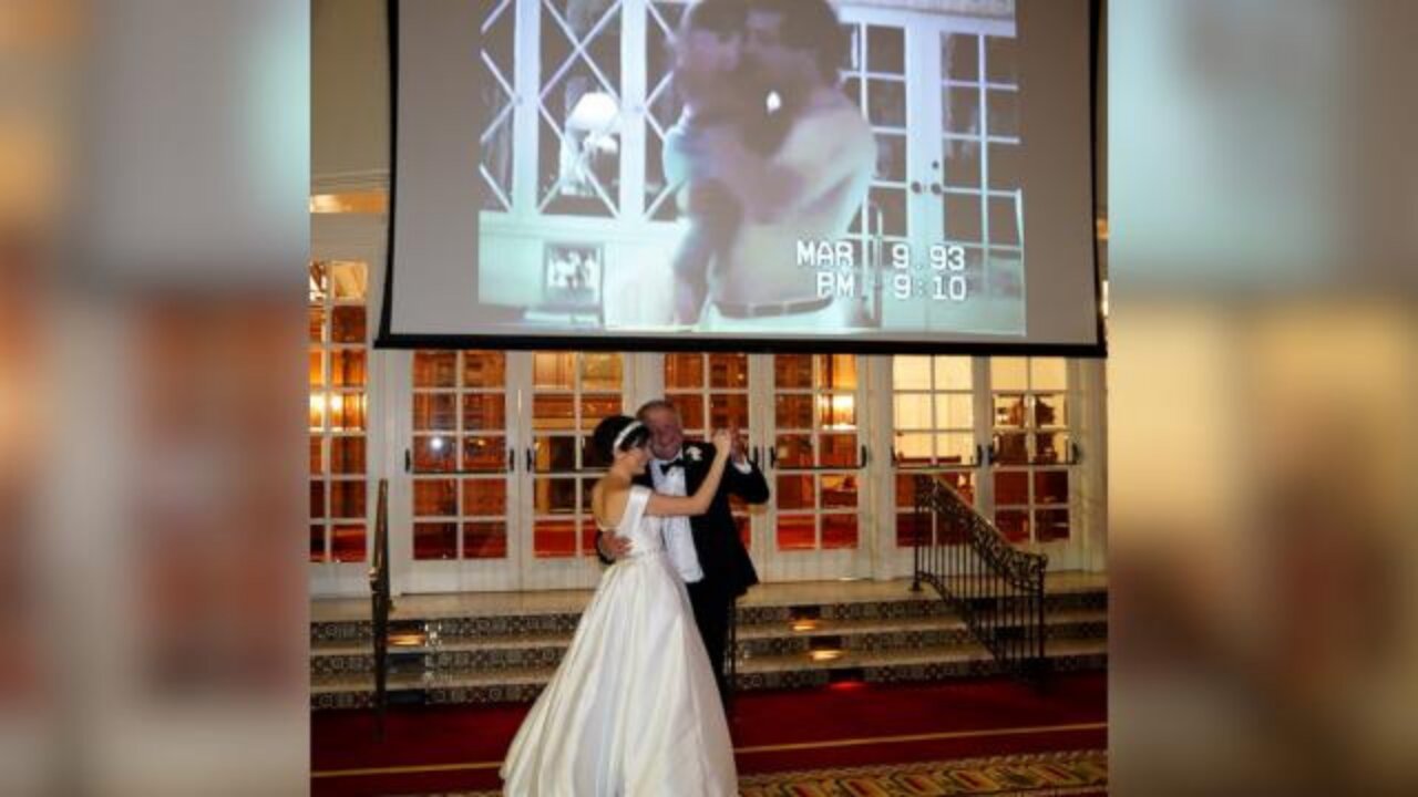 Bride and father share an emotional moment during the father-daughter dance