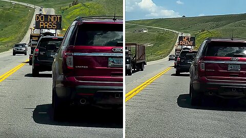 Reckless car drives over a freshly painted line, ignoring warning sign