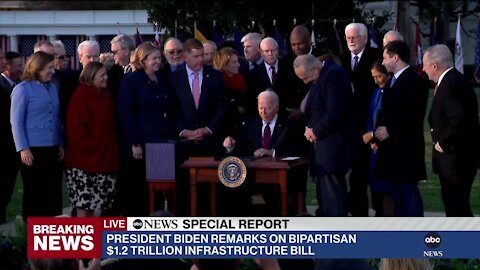 Biden signs infrastructure bill into law at White House ceremony