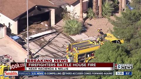 Firefighters battle house fire near Hacienda, Nellis