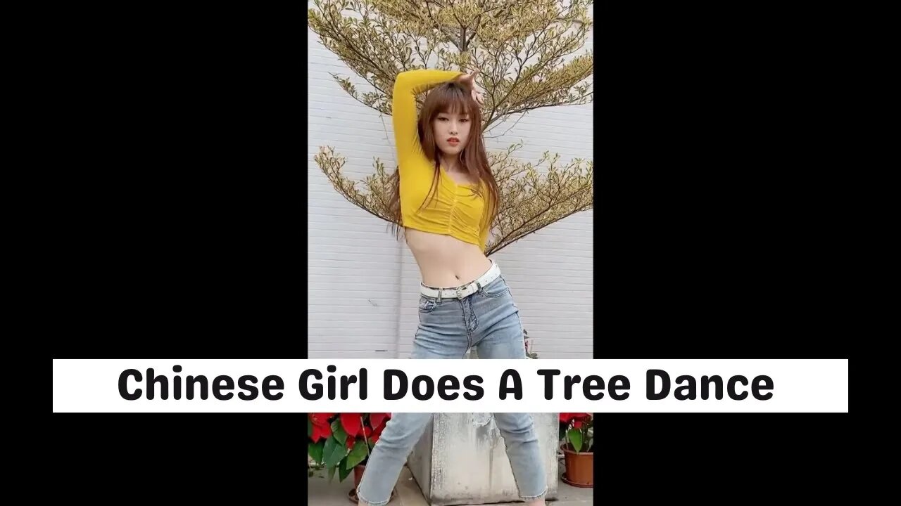 Sexy Chinese Girl Dances In Front Of A Christmas Tree