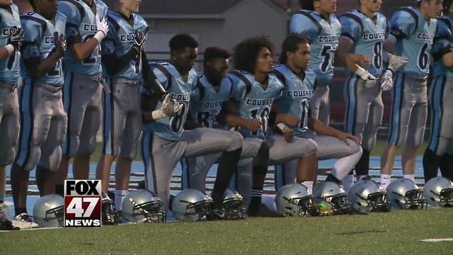 Lansing high school says athletes can't play if they kneel during the National Anthem