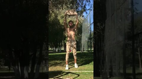 Shoulder press exercise with the rock