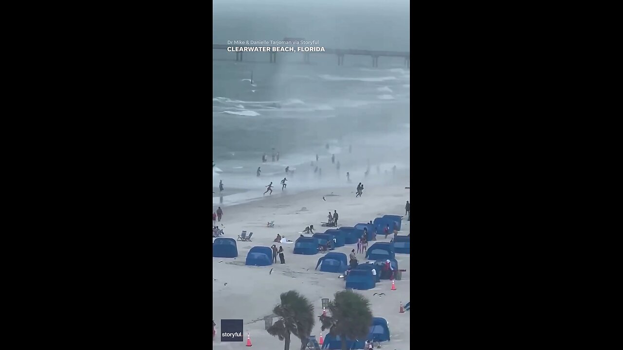 usa footage capture water spout ripping through crowded beach