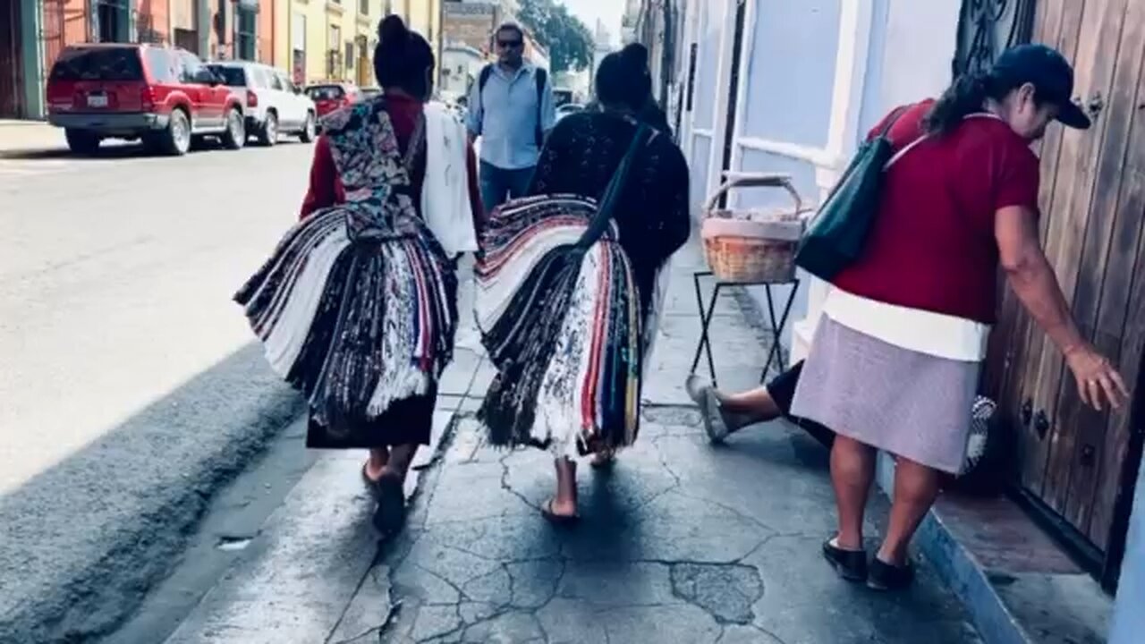 Young ladies talk on way to the plaza