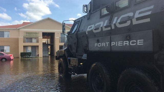 Fort Pierce police use MRAPS to help people in flooded areas