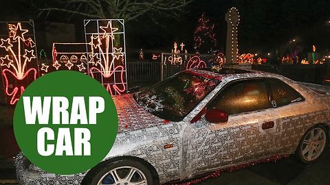 A Christmas fanatic has dressed his car up in wrapping paper