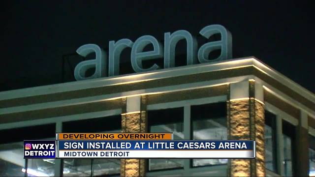 Sign installation begins on the outside of Little Caesars Arena