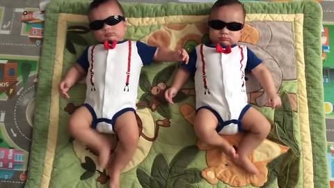 "Twin Baby Boys Dance With Sunglasses On"