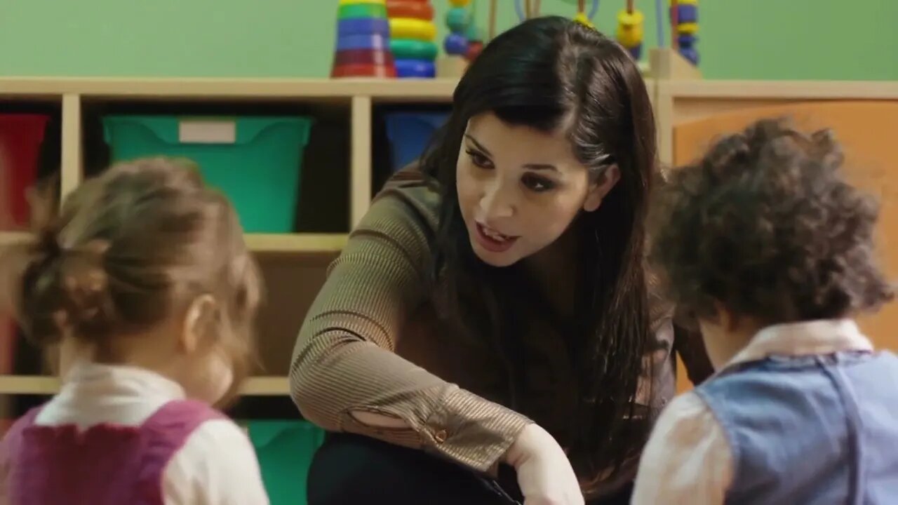 Educator and little baby girls reading fairy tale at preschool, teacher, children, school, education