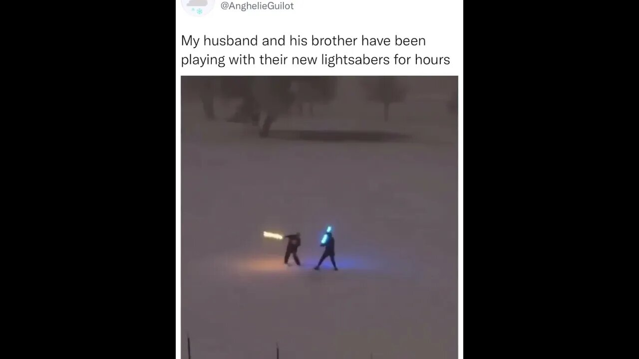 Two men are having fun playing with their lightsabers.