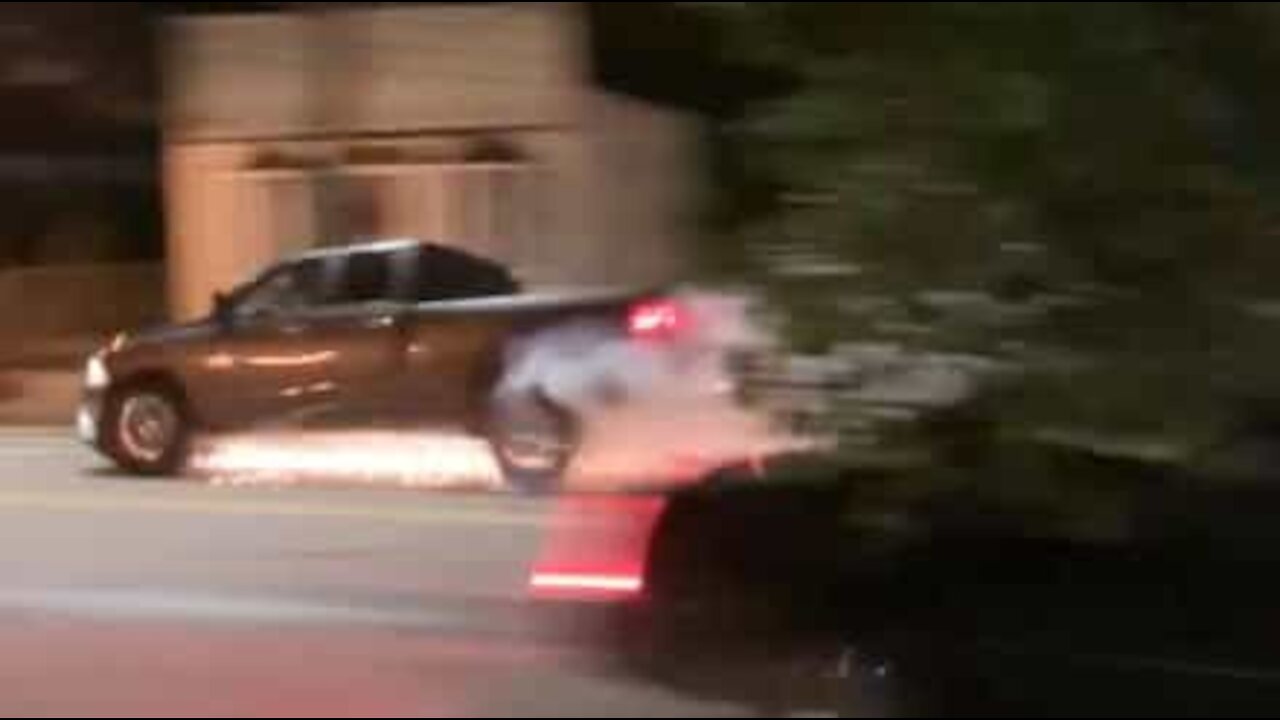 Car speeds by under shower of sparks!