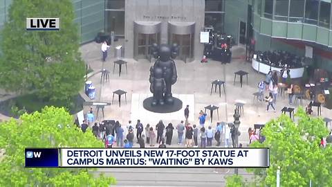 Detroit unveils new 17 foot statue at Campus Maritus: Waiting by Kaws