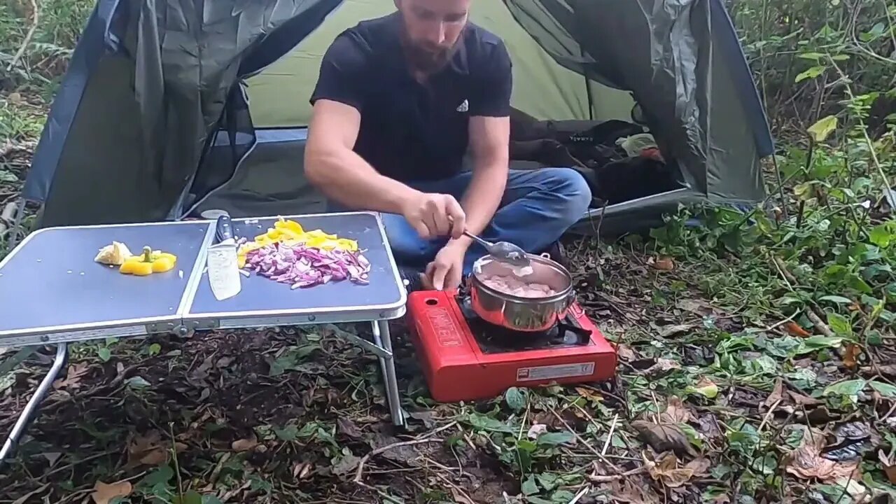 An abundance of camping food in the wilderness.17