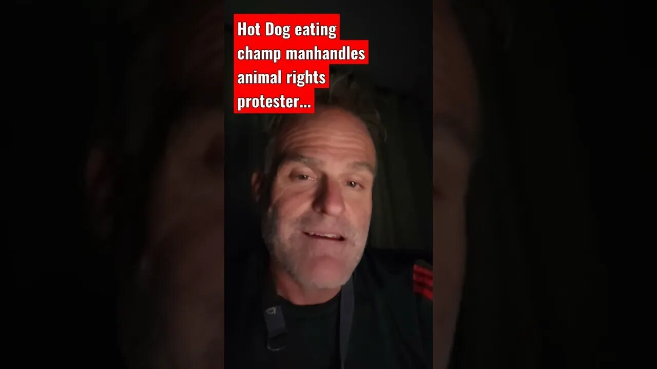 Hot Dog eating champ wins and still takes down protester.