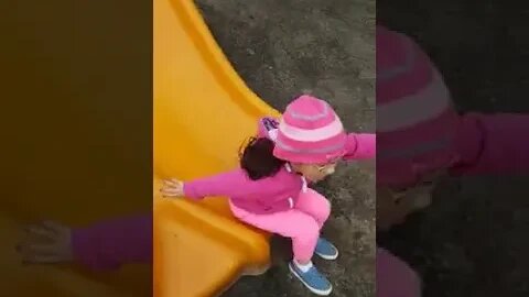 Cutie baby girls in the park playing