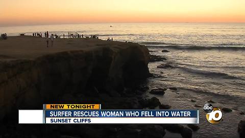 Surfer rescues woman who fell into water