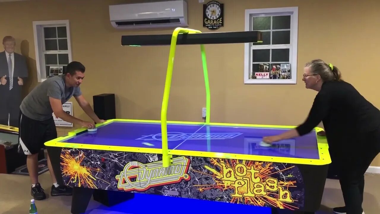 BLUE BLOODS Actor Derek Hedlund plays air hockey with VFAF's Donna Fitzgerald at the Fitzgerald Home