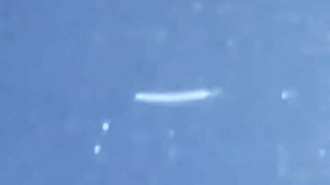 Bright Cigar UFO Twisting Flyby