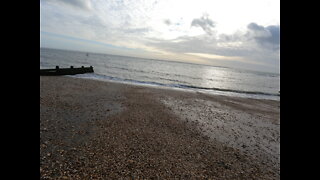 Coffee time. L. overlooking the sea. On a beach