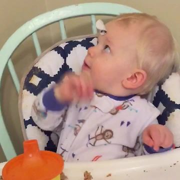 Baby Boy Tries To Look At A Sticker On His Forehead
