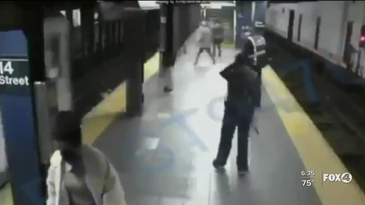 Man pushes woman into train