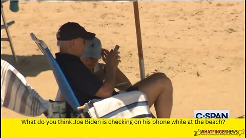 What do you think Joe Biden is checking on his phone while at the beach?