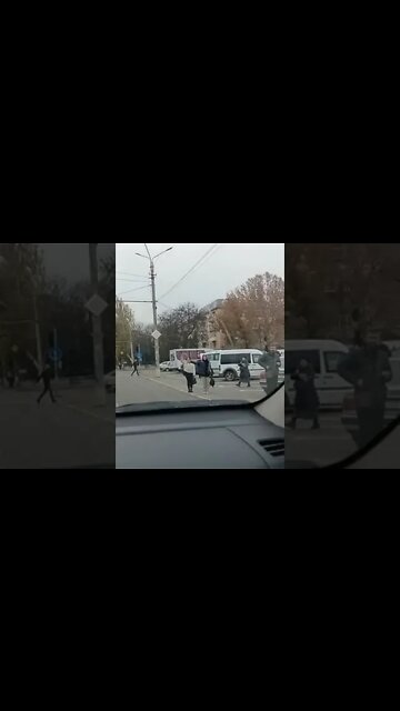 The central street in Kherson, people greet the military with the anthem playing