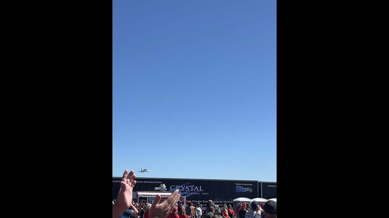 Trump flies over rally before landing