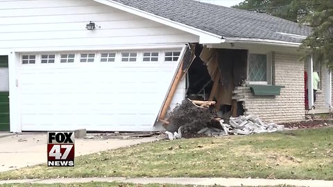 Car crashes into house in South Lansing