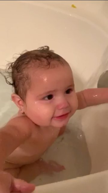 Adorable Baby Girl Tries to Catch Water