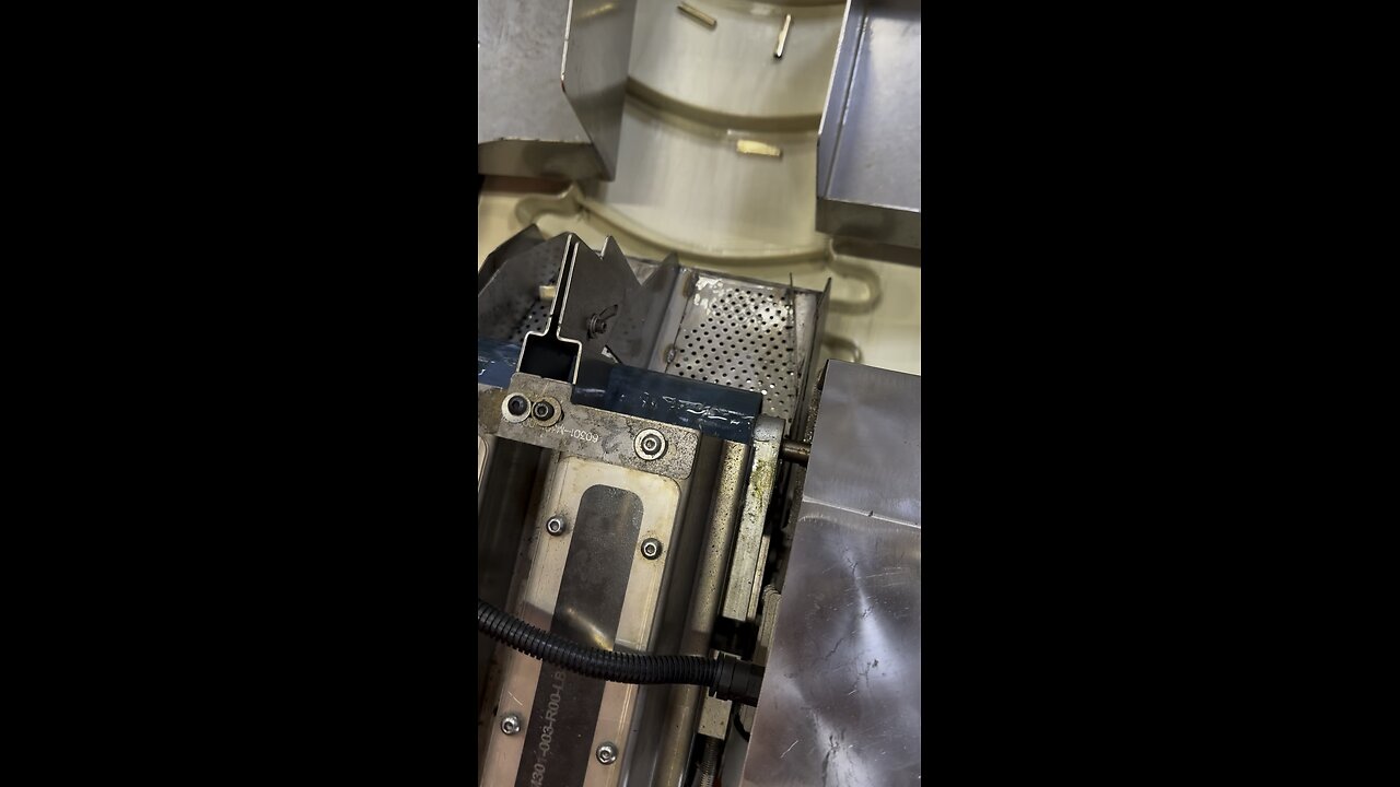 5.56 ammo being manufactured. Here the cases are being drawn out