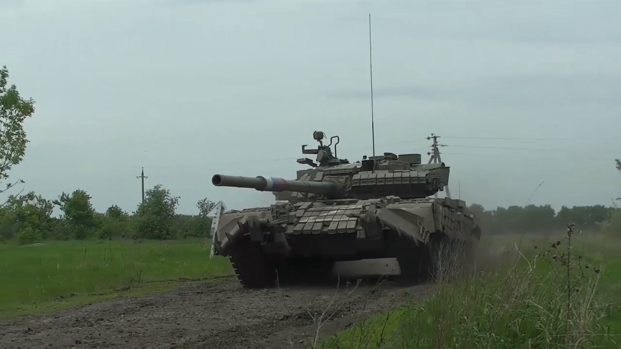 Russian T-80BV tank and BTR-82A armoured carrier crews in combat action