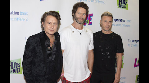 Take That are 'desperate' to get back on the road again as soon as it's safe for fans