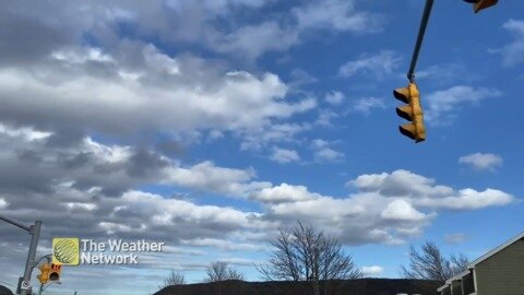 Bright blue skies taken over by ominous clouds