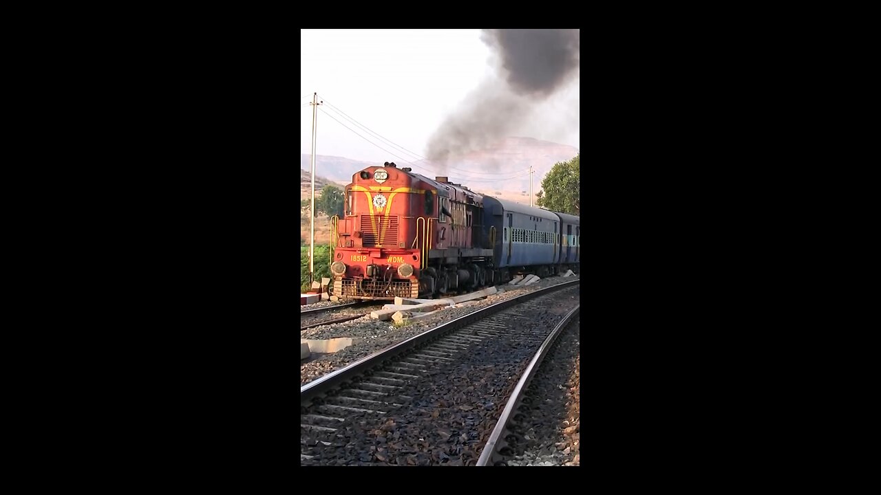 The classic ALCo smoking and chugging action of timeless Maroon liveried PUNE 150K WDM-2 18512