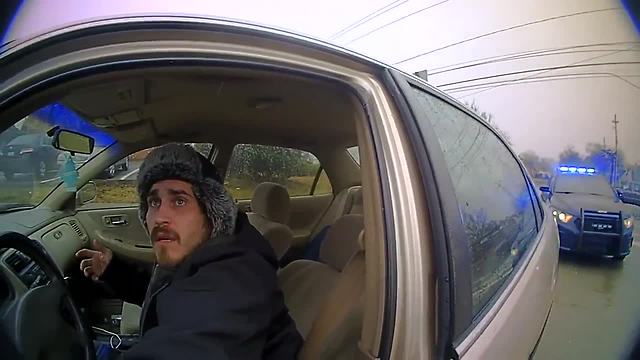 Body cam: Man drags officer after confrontation during traffic stop